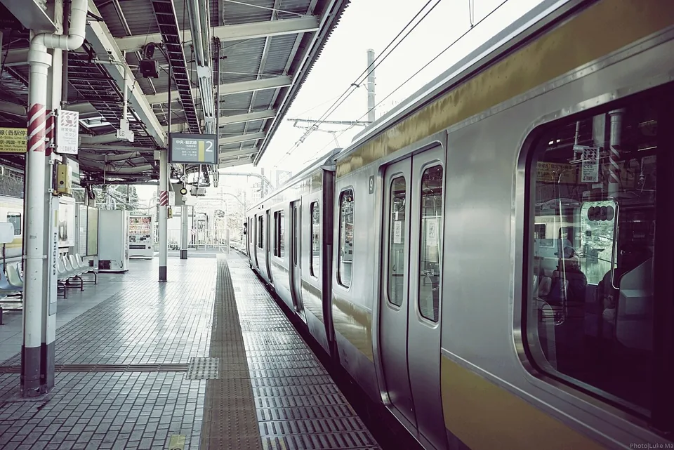 A commuter train next to the platform at Ichigaya Station, Tokyo